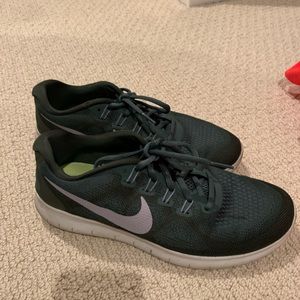 Minimally used Nike free run in dark green